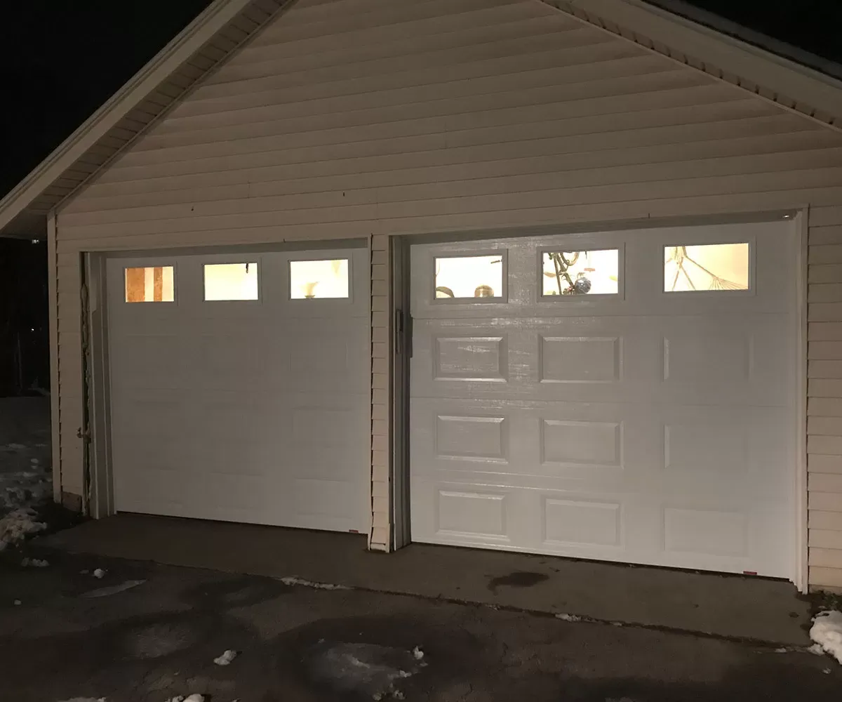Broken Garage Door Spring Replacement Expert Garage Door Repair in Brookline replacing a broken garage door spring safely