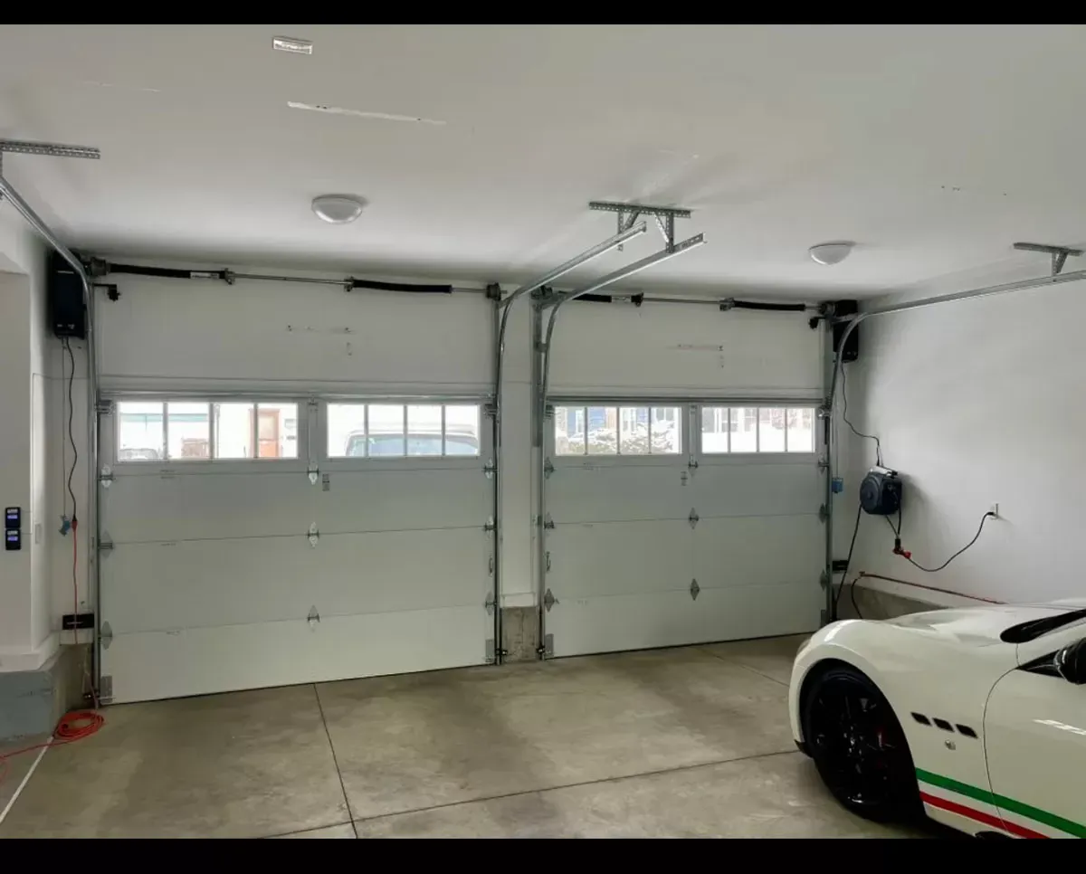 Residential Garage Door Repair Technician Professional technician providing Garage Door Repair in Brookline for a residential garage door